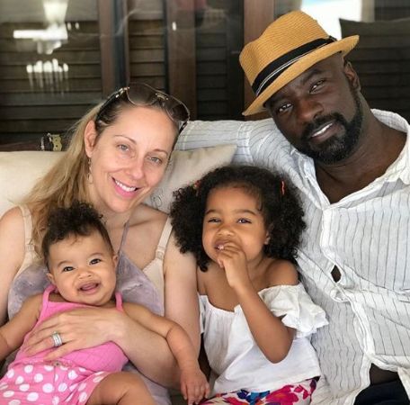 Mike Colter and Iva Colter with their kids. 